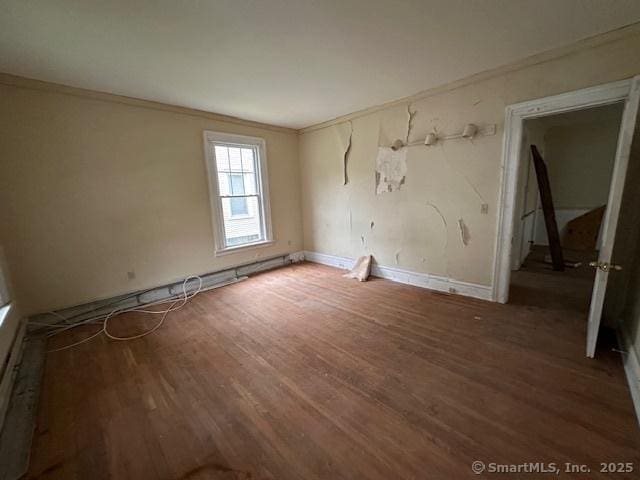 29 Division St, Norwich, CT 06360 - empty room with crown molding and wood finished floors