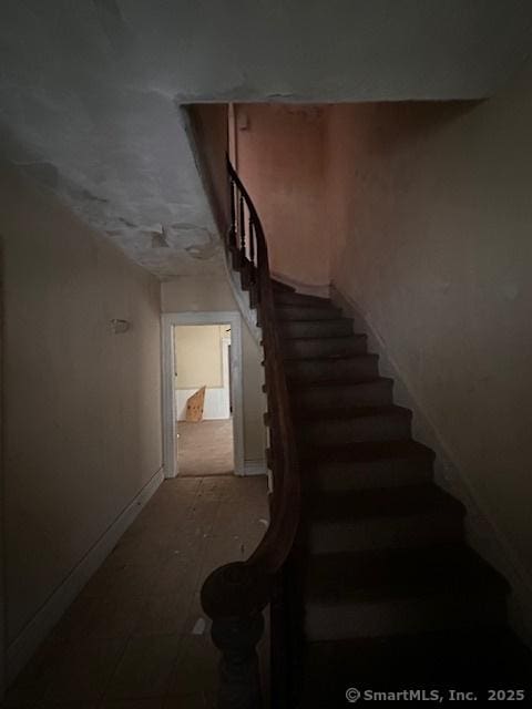 29 Division St, Norwich, CT 06360 - staircase featuring baseboards