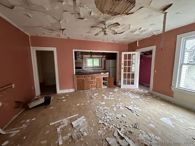 29 Division St, Norwich, CT 06360 - unfurnished living room with a ceiling fan