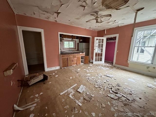 29 Division St, Norwich, CT 06360 - unfurnished living room with ceiling fan