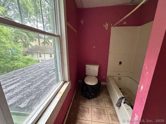 29 Division St, Norwich, CT 06360 - bathroom with toilet and tile patterned floors