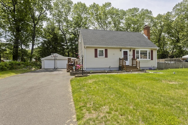 309 S Elm St, Windsor Locks, CT 06096 - view of front of home featuring an outdoor structure, a detached garage, a chimney, and roof with shingles