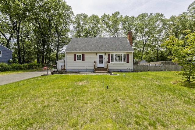 309 S Elm St, Windsor Locks, CT 06096 - view of front of house featuring a chimney, an outbuilding, and entry steps