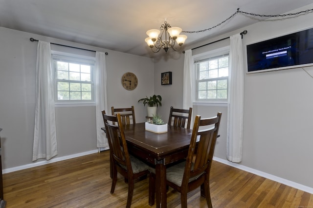 309 S Elm St, Windsor Locks, CT 06096 - dining area featuring a chandelier, wood finished floors, plenty of natural light, and baseboards
