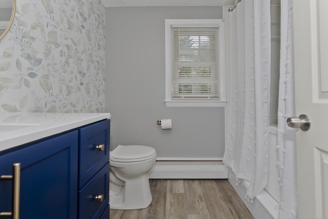 309 S Elm St, Windsor Locks, CT 06096 - bathroom with baseboard heating, vanity, wood finished floors, and toilet