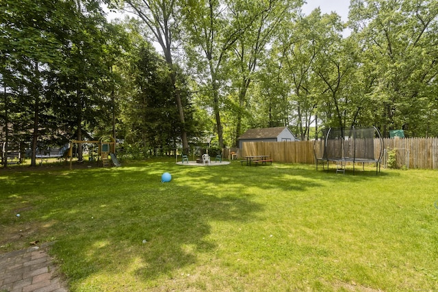 309 S Elm St, Windsor Locks, CT 06096 - view of yard featuring a trampoline and a playground
