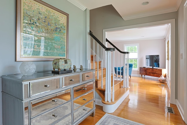 402 Jones Hill Rd, West Haven, CT 06516 - corridor featuring wood finished floors, stairway, and crown molding