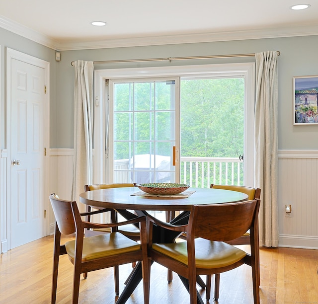 402 Jones Hill Rd, West Haven, CT 06516 - dining area with light wood-style floors, wainscoting, ornamental molding, and a decorative wall