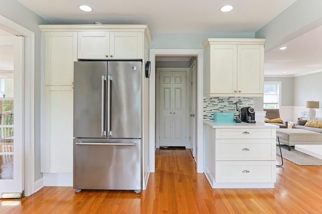 402 Jones Hill Rd, West Haven, CT 06516 - kitchen with high end refrigerator, light wood-style flooring, light countertops, and recessed lighting