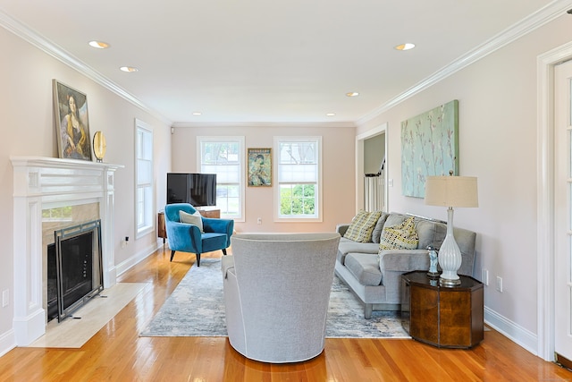 402 Jones Hill Rd, West Haven, CT 06516 - living room with light wood-type flooring, ornamental molding, a fireplace, and recessed lighting