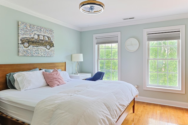 402 Jones Hill Rd, West Haven, CT 06516 - bedroom featuring multiple windows, crown molding, and light wood finished floors