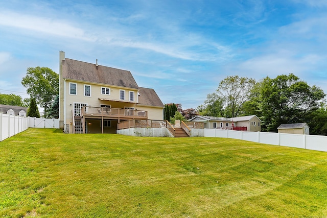 402 Jones Hill Rd, West Haven, CT 06516 - back of property with stairway, a deck, a fenced backyard, and a chimney