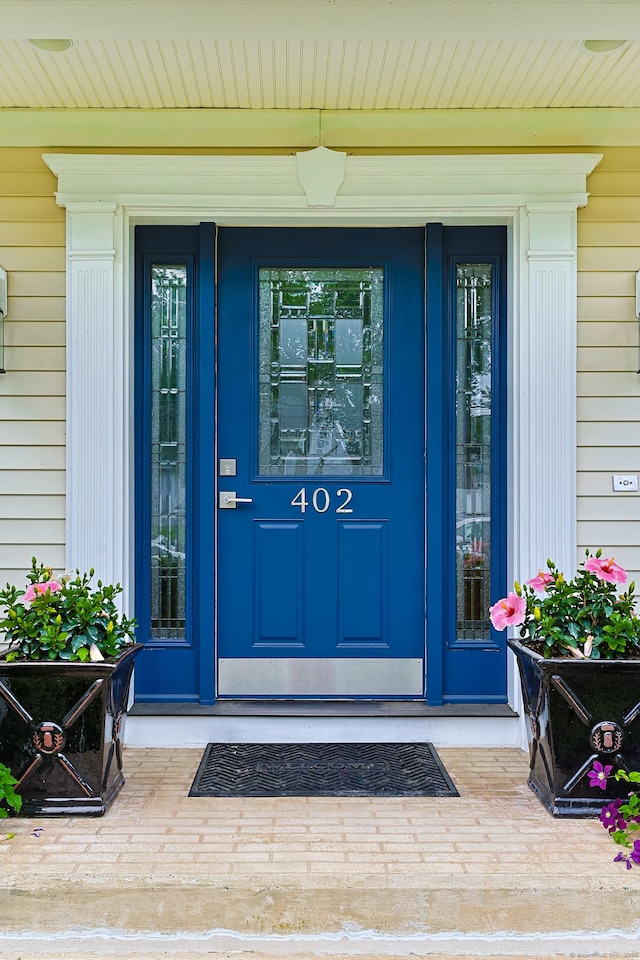 402 Jones Hill Rd, West Haven, CT 06516 - doorway to property featuring covered porch