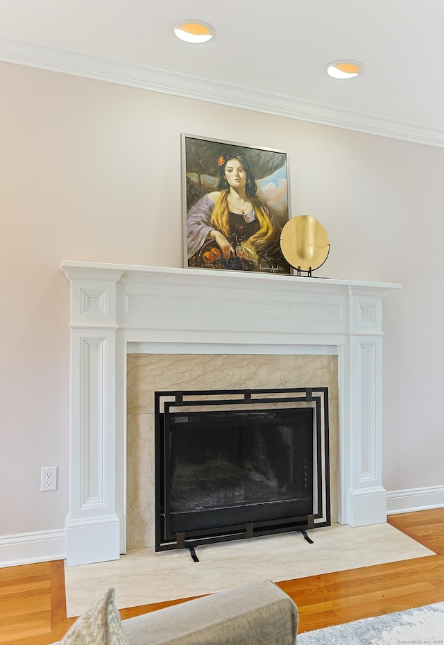 402 Jones Hill Rd, West Haven, CT 06516 - detailed view of a premium fireplace, wood finished floors, and crown molding