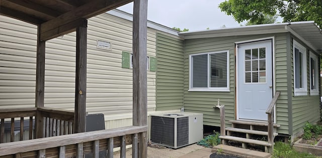1290 N Rd Unit 15, Groton, CT 06340 - view of property exterior featuring central AC unit and entry steps