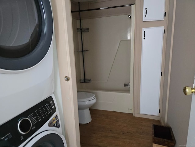 1290 N Rd Unit 15, Groton, CT 06340 - bathroom with stacked washer / drying machine, wood finished floors, toilet, and bathing tub / shower combination