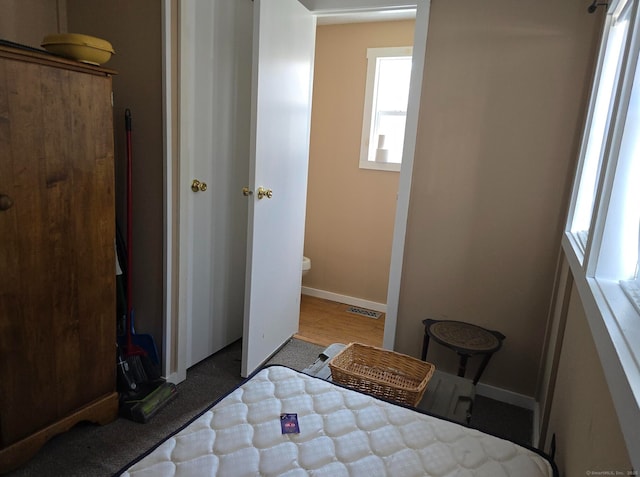 1290 N Rd Unit 15, Groton, CT 06340 - bedroom with multiple windows and baseboards