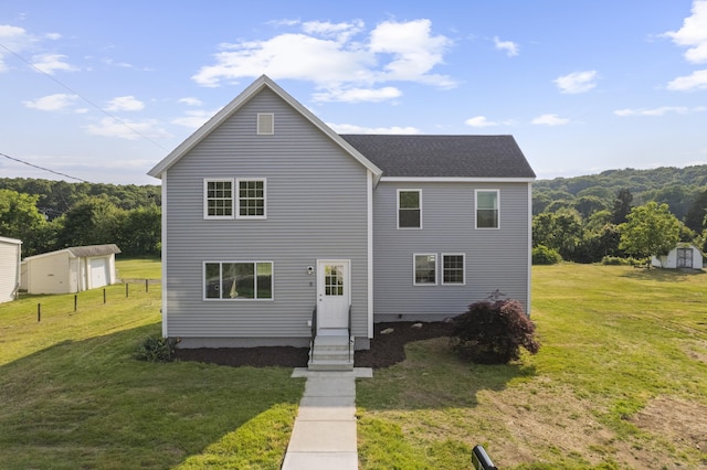 8 Wilson Ave, Waterford, CT 06375 - view of front facade with a front lawn and an outdoor structure