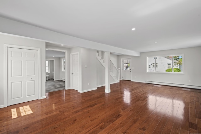 8 Wilson Ave, Waterford, CT 06375 - unfurnished living room featuring baseboard heating, stairway, wood-type flooring, recessed lighting, and baseboards