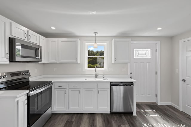 8 Wilson Ave, Waterford, CT 06375 - kitchen featuring stainless steel appliances, a sink, light countertops, white cabinets, and recessed lighting