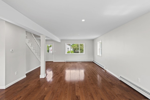 8 Wilson Ave, Waterford, CT 06375 - unfurnished living room featuring a baseboard radiator, stairs, baseboards, hardwood / wood-style flooring, and recessed lighting
