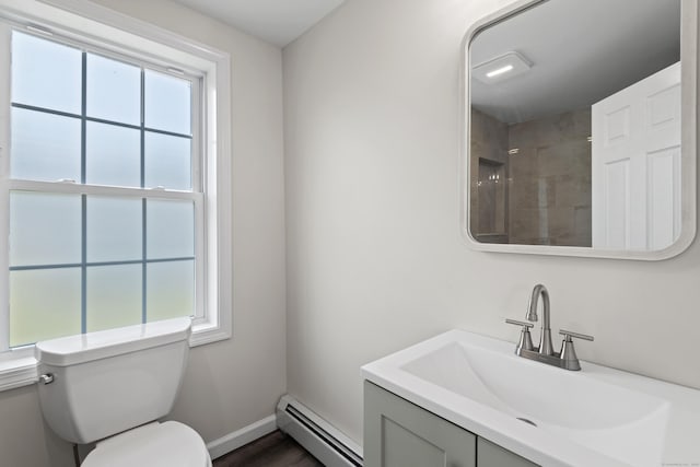 8 Wilson Ave, Waterford, CT 06375 - full bathroom with a baseboard heating unit, toilet, vanity, and baseboards