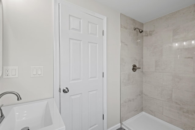 8 Wilson Ave, Waterford, CT 06375 - bathroom featuring a sink and a tile shower