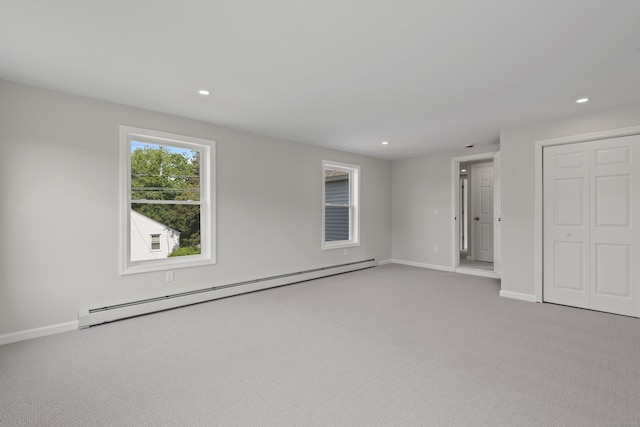 8 Wilson Ave, Waterford, CT 06375 - unfurnished bedroom with a baseboard heating unit, light colored carpet, baseboards, and recessed lighting