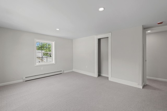8 Wilson Ave, Waterford, CT 06375 - unfurnished bedroom with baseboard heating, light carpet, recessed lighting, baseboards, and a closet