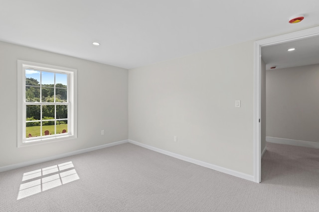 8 Wilson Ave, Waterford, CT 06375 - empty room featuring light carpet, baseboards, a smoke detector, and recessed lighting