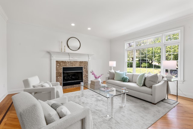 35 Hunting Ridge Rd, Easton, CT 06612 - living area featuring baseboards, crown molding, wood finished floors, a tiled fireplace, and recessed lighting