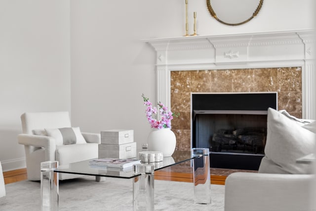 35 Hunting Ridge Rd, Easton, CT 06612 - interior space with wood finished floors, a tiled fireplace, and baseboards
