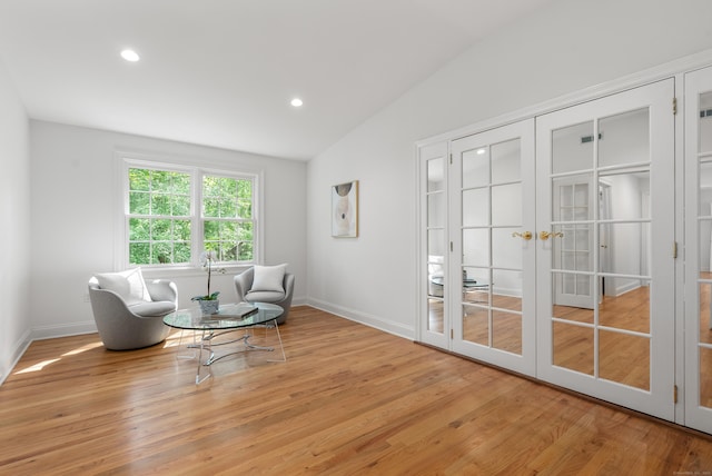 35 Hunting Ridge Rd, Easton, CT 06612 - living area with french doors, wood finished floors, lofted ceiling, recessed lighting, and baseboards