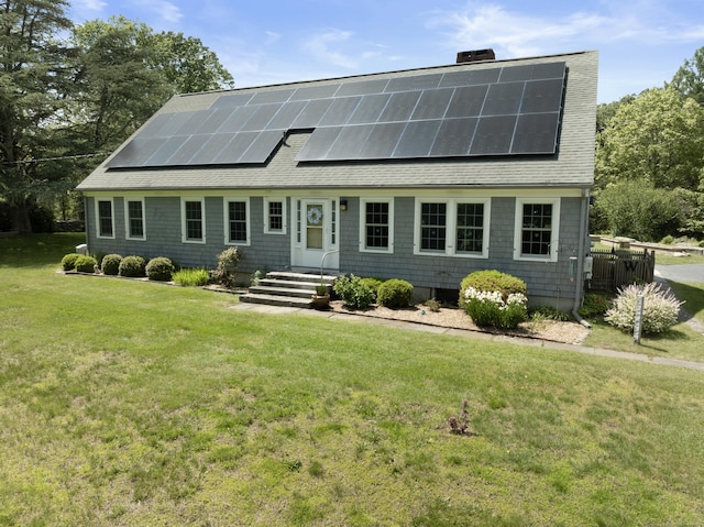 104 Quaker Farm Rd, Groton, CT 06355 - view of front facade with a shingled roof, a front yard, a chimney, and solar panels