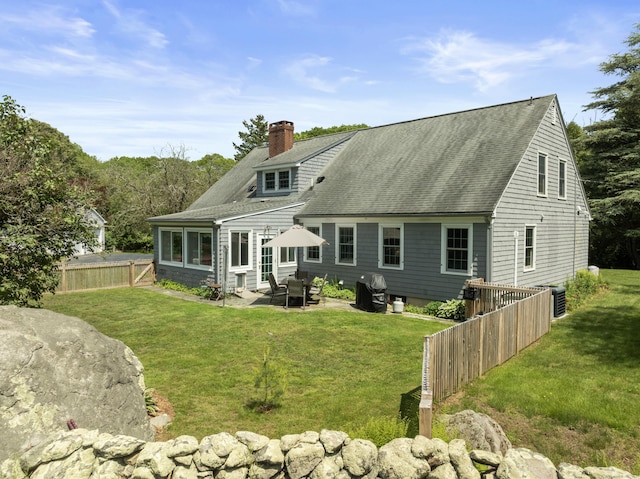 104 Quaker Farm Rd, Groton, CT 06355 - rear view of property with a chimney, a patio, a shingled roof, and cooling unit