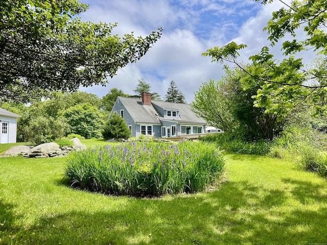 104 Quaker Farm Rd, Groton, CT 06355 - back of property with a chimney and a yard