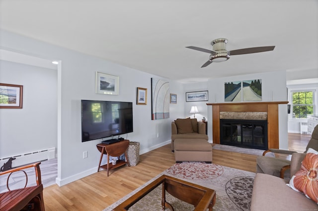 104 Quaker Farm Rd, Groton, CT 06355 - living room with a ceiling fan, wood finished floors, a premium fireplace, and baseboards