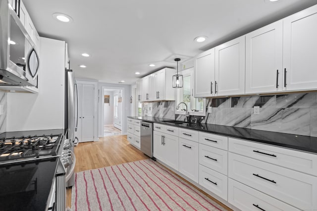 104 Quaker Farm Rd, Groton, CT 06355 - kitchen featuring appliances with stainless steel finishes, a sink, recessed lighting, white cabinets, and dark countertops