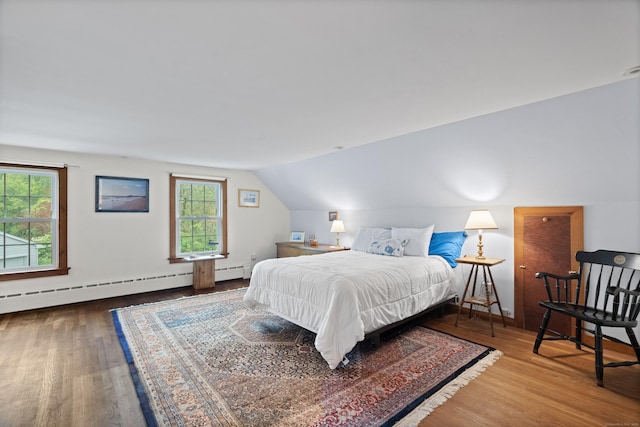 104 Quaker Farm Rd, Groton, CT 06355 - bedroom with multiple windows, wood finished floors, lofted ceiling, baseboard heating, and baseboards