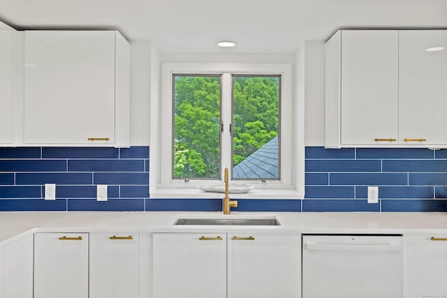 70 Prospect Hill Rd, Groton, CT 06340 - kitchen featuring white dishwasher, a sink, light countertops, white cabinets, and backsplash