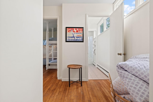70 Prospect Hill Rd, Groton, CT 06340 - bedroom with light wood-style floors and baseboard heating