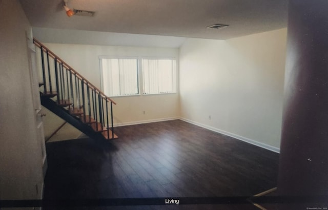 280 Brittany Farms Rd Apt C, New Britain, CT 06053 - unfurnished living room with hardwood / wood-style flooring, stairway, and baseboards