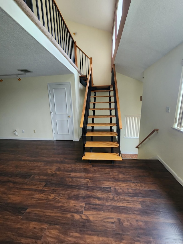 280 Brittany Farms Rd Apt C, New Britain, CT 06053 - staircase with wood finished floors and a textured ceiling