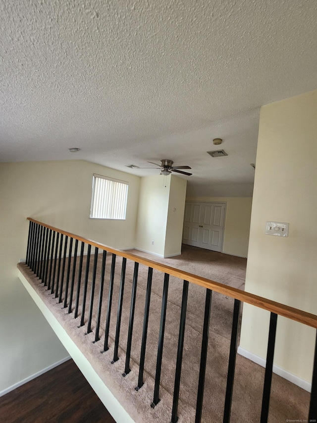 280 Brittany Farms Rd Apt C, New Britain, CT 06053 - stairs featuring a ceiling fan, a textured ceiling, and wood finished floors