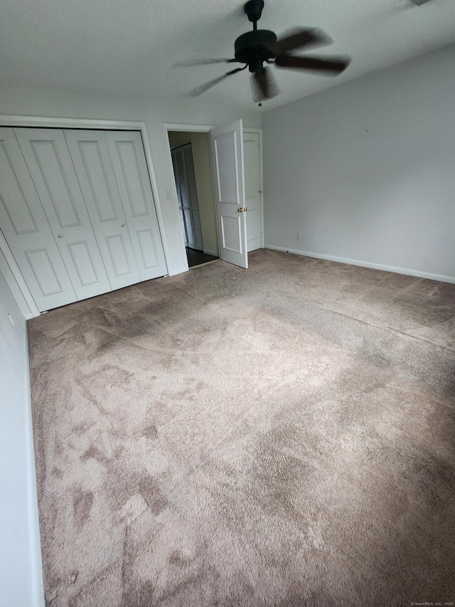280 Brittany Farms Rd Apt C, New Britain, CT 06053 - unfurnished bedroom featuring carpet flooring, a closet, and a ceiling fan