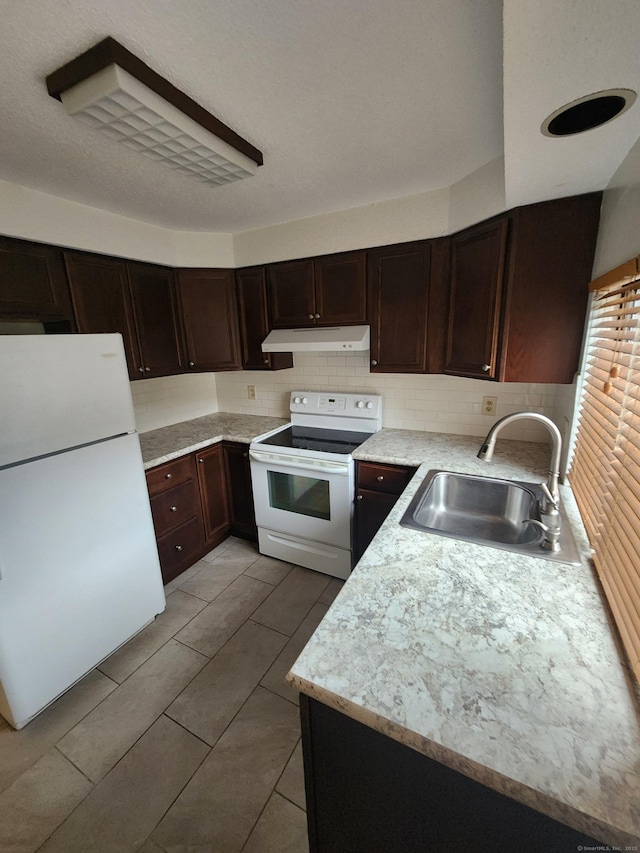 280 Brittany Farms Rd Apt C, New Britain, CT 06053 - kitchen with white appliances, under cabinet range hood, light countertops, and dark brown cabinetry