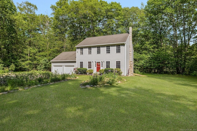 58 Snake Meadow Rd, Killingly, CT 06239 - colonial house with a chimney, a front lawn, and a garage