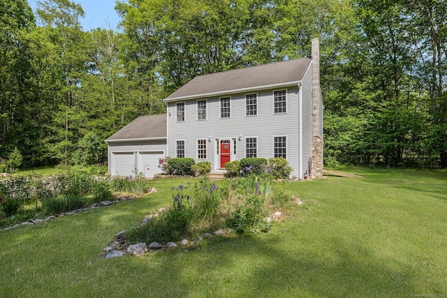 58 Snake Meadow Rd, Killingly, CT 06239 - colonial house with a chimney, a front yard, and roof with shingles
