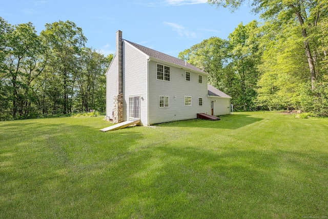 58 Snake Meadow Rd, Killingly, CT 06239 - rear view of property featuring a chimney and a yard