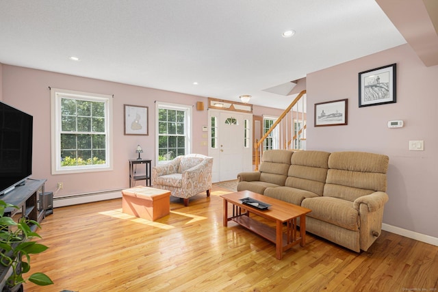 58 Snake Meadow Rd, Killingly, CT 06239 - living room with a baseboard radiator, light wood-style flooring, stairway, recessed lighting, and baseboards